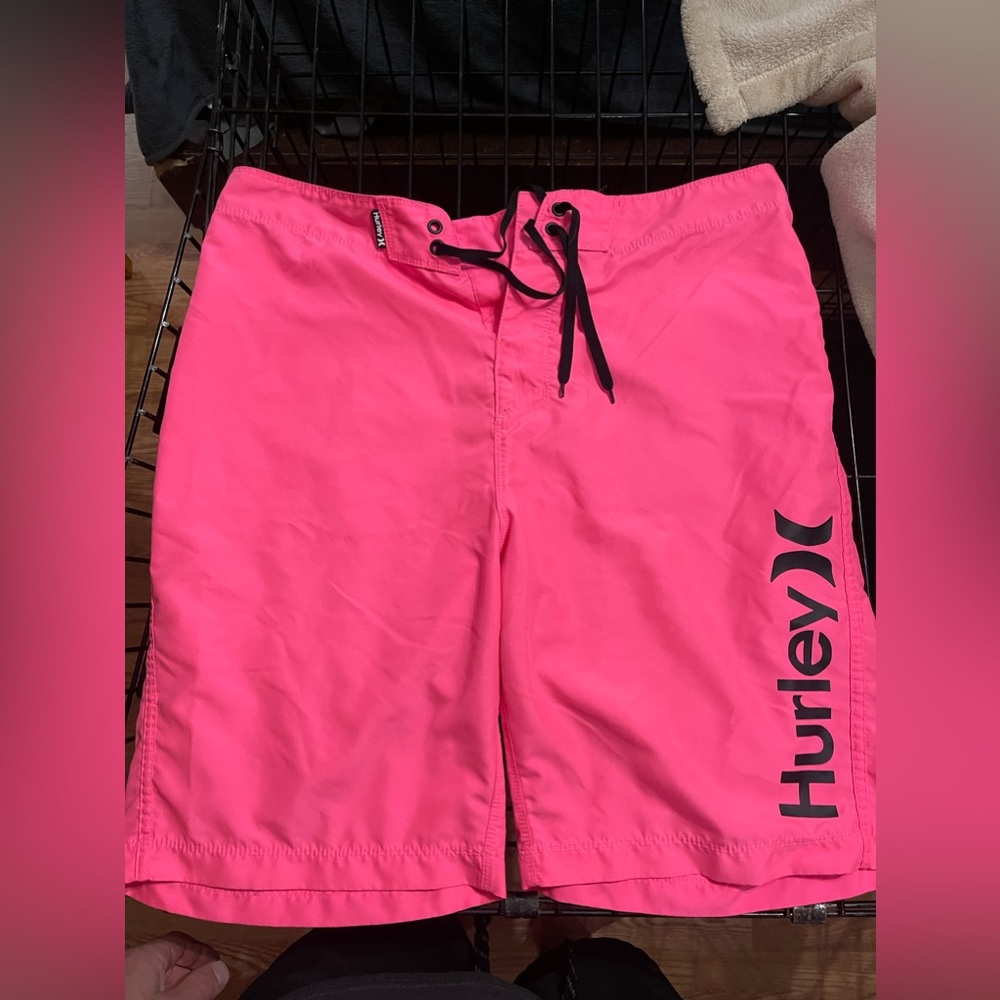 Men’s pink Hurley board shorts.